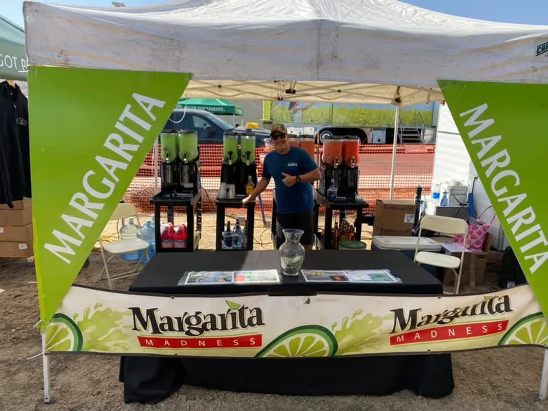 Margarita booth with machines at an outdoor festival