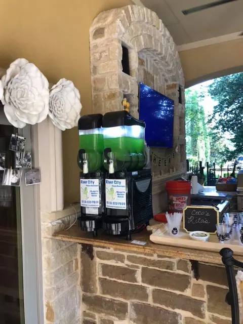 Margarita machine in an outdoor stone kitchen
