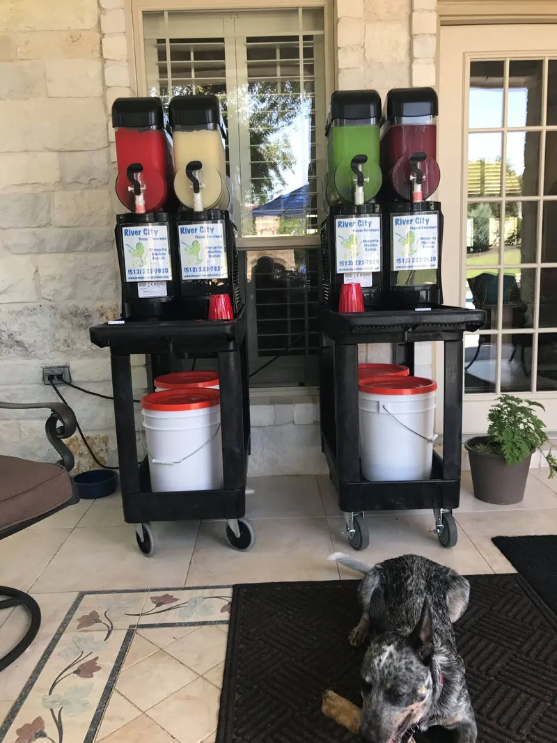 Margarita machines on carts on a covered patio