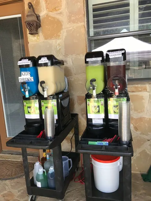 Two margarita machines on rolling carts